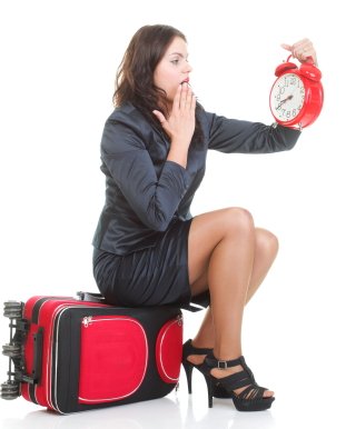 women_sitting_clock_suitcase